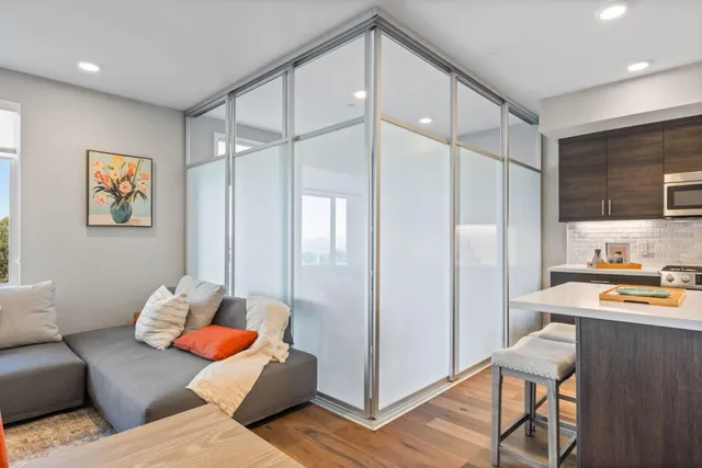 a living room with furniture and a table