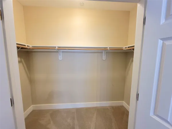 an empty room with a mirror