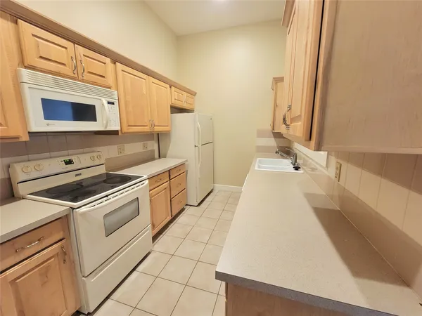 a bathroom with a sink a mirror and a bathtub
