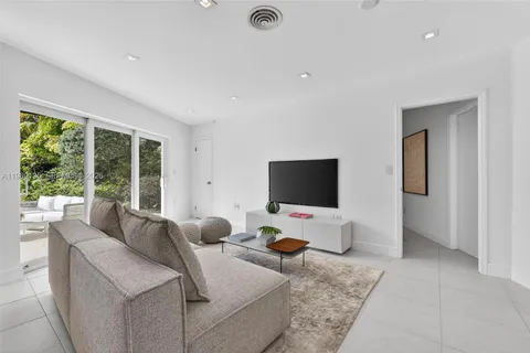 a living room with a couch and a window