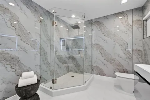 a view of a patio with couches and potted plants