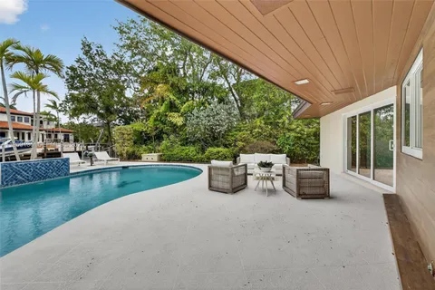 front view of a house with a swimming pool
