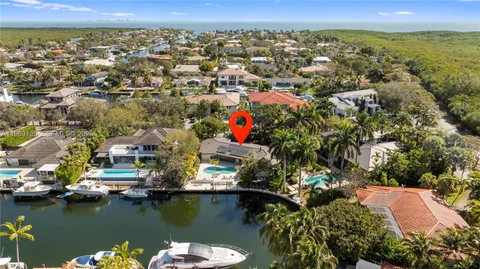 an aerial view of a residential houses with outdoor space