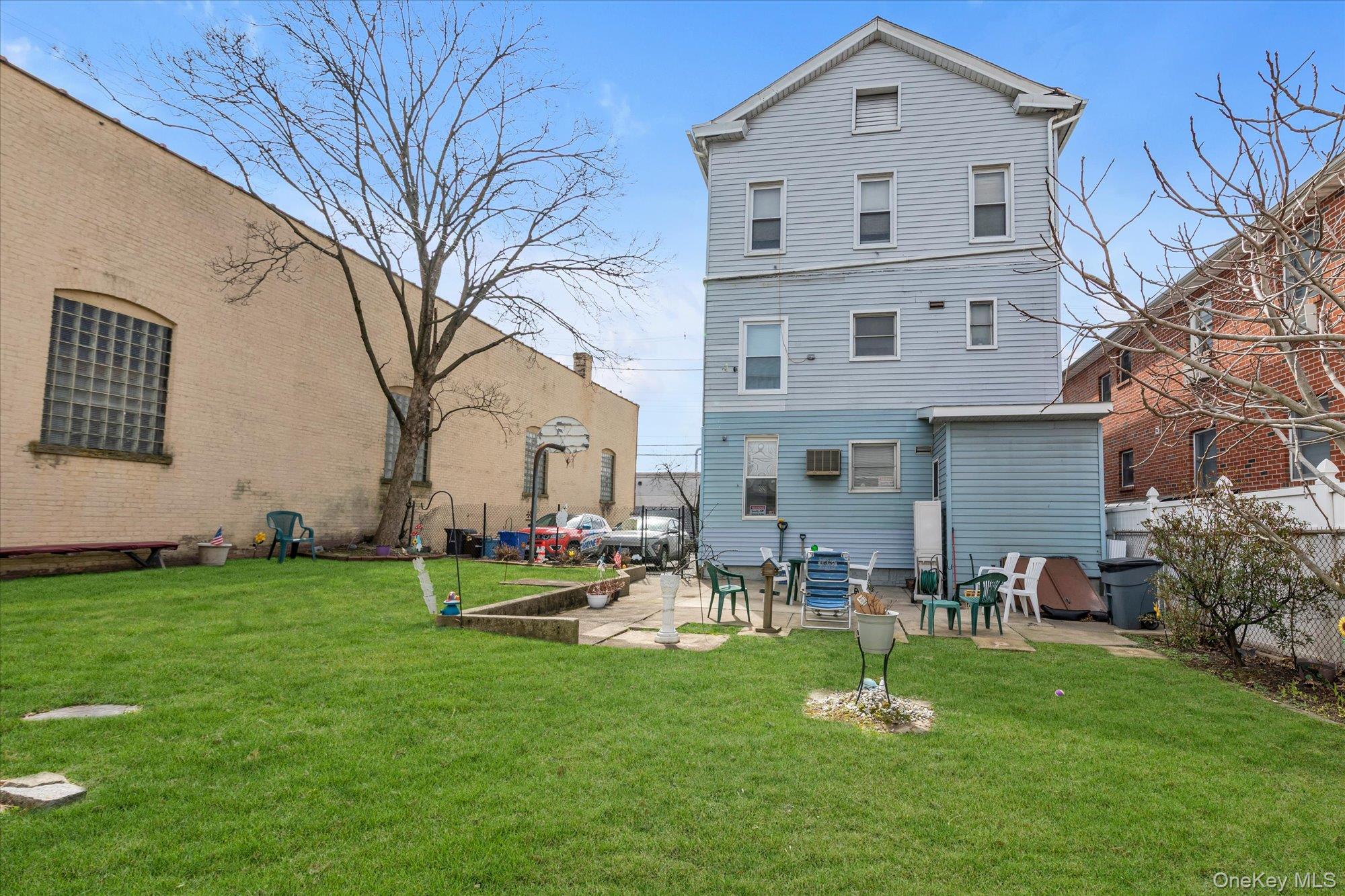 117-11 14th Road Queens, NY 11356 - Photo 20 of 23 View of backyard patio.