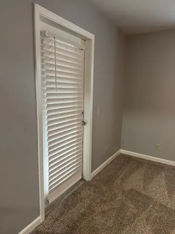 a view of a room that has a window in it