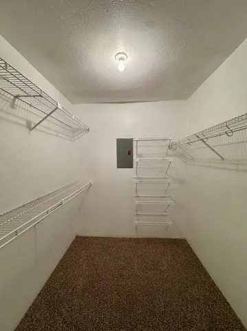 a view of a room with racks on the wall