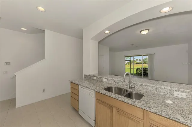 a living room with furniture a window and a table