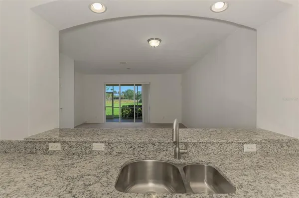 a view of empty room with windows