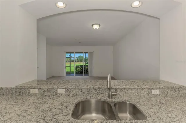 a view of empty room with windows