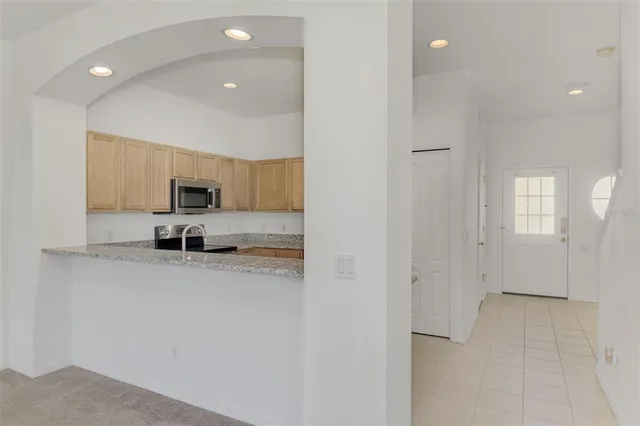 a view of room with window and ceiling fan