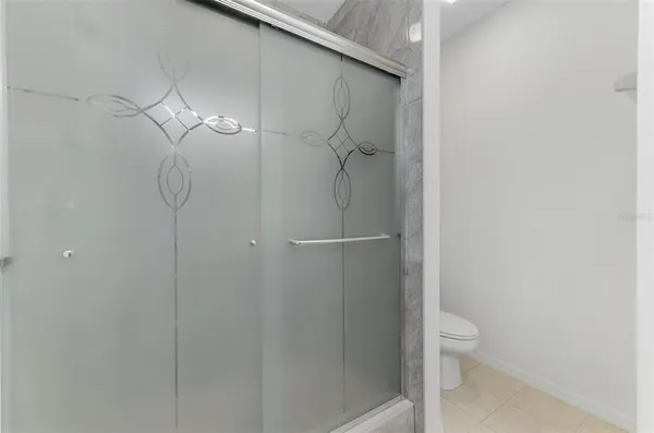 a bathroom with a sink toilet and mirror