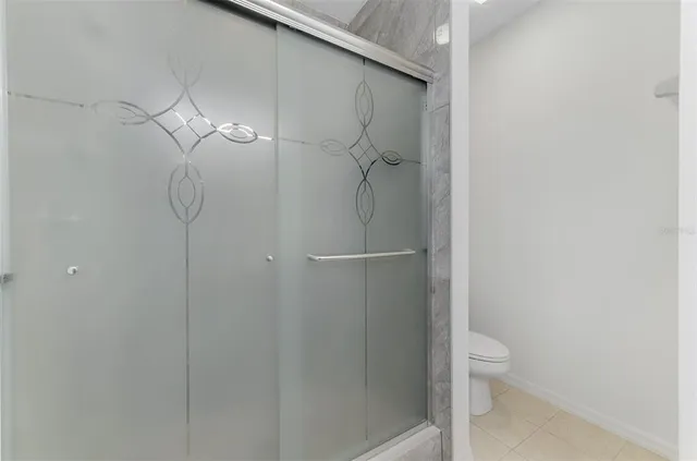 a bathroom with a sink toilet and mirror