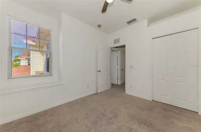 a view of an empty room with glass door