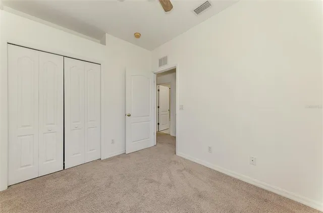 an aerial view of a house with a yard and garden