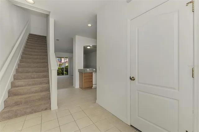 a kitchen with stainless steel appliances granite countertop a refrigerator stove and sink