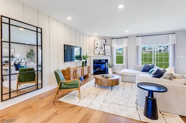 a living room with fireplace furniture and a fireplace