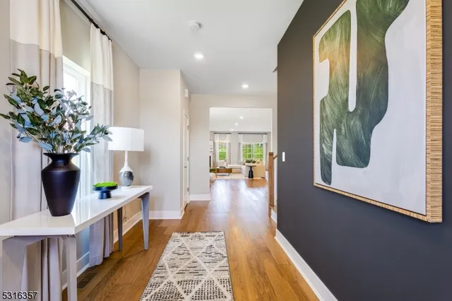 a view of living room kitchen and entryway