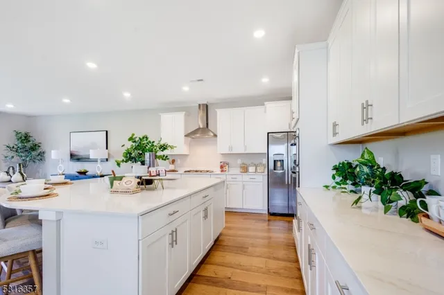 a kitchen with sink and refrigerator