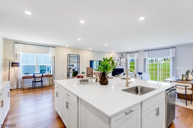 a kitchen with sink and cabinets