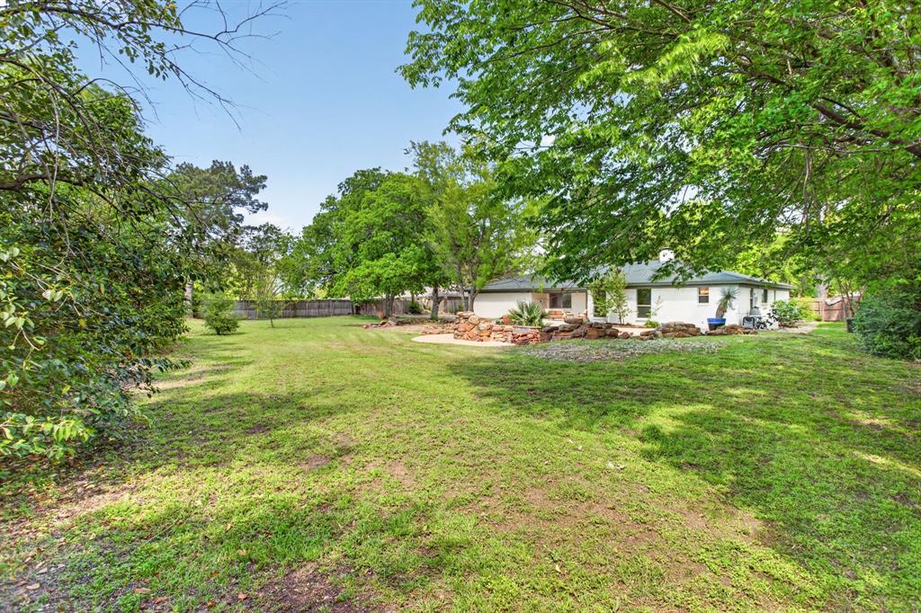 4316 Winding Way Benbrook, TX 76126 - Photo 36 of 40 a view of yard with swimming pool and trees
