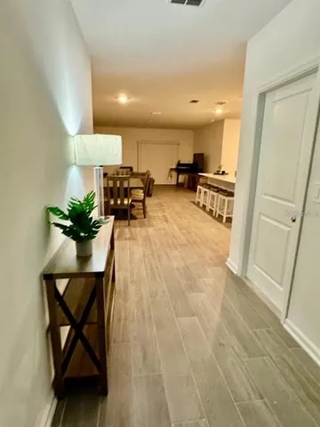 a bathroom with a shower sink and mirror