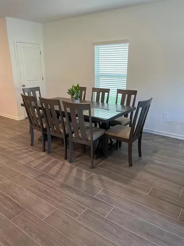 a living room with couches and a couch