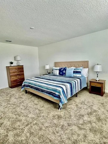 a kitchen with a stove a sink and a refrigerator