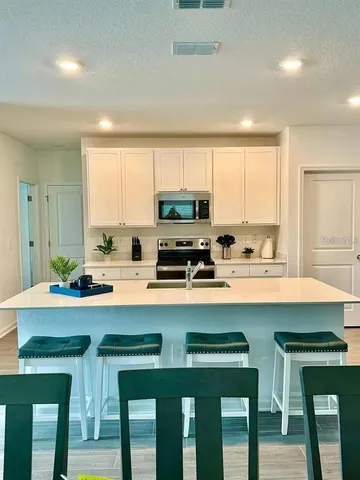 a living room with furniture and a rug