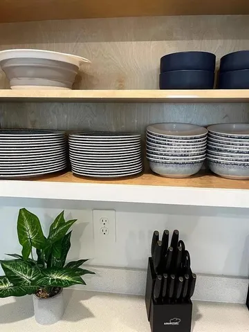 a aerial view of a brick house next to a yard