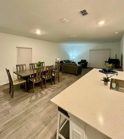 a bedroom with a bed and a chair