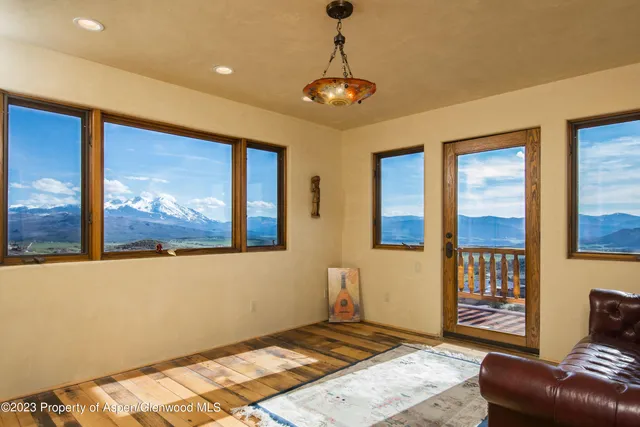 a bedroom with furniture and windows