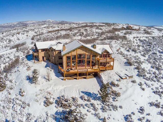 a view of a large building with a yard