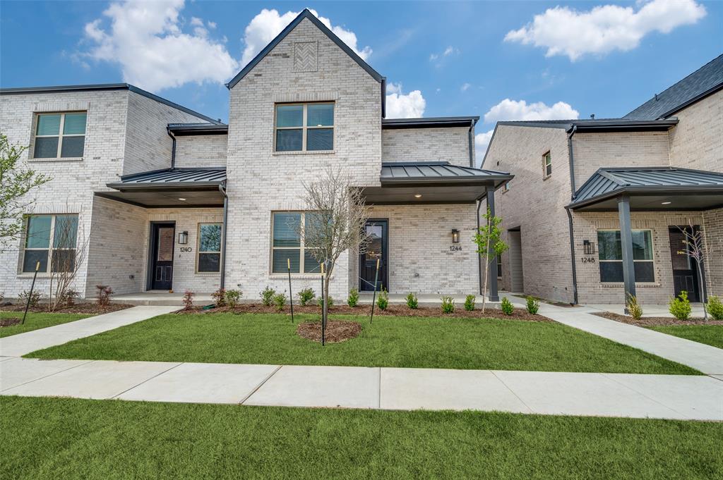 1244 Eureka Spgs Street Prosper, TX 75078 - Photo 1 of 1 Inviting brick exterior with durable metal roof and manicured front lawn offers a warm and welcoming first impression.