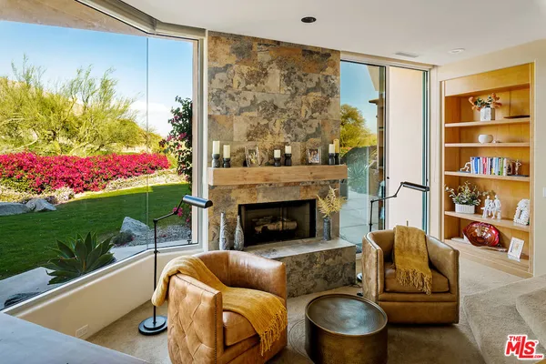 a bedroom with a large bed and a flat screen tv