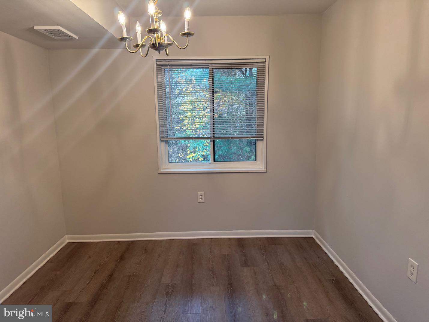 1400 Northgate Square, Unit 11A Reston, VA 20190 - Photo 12 of 23 a view of a room with wooden floor and windows