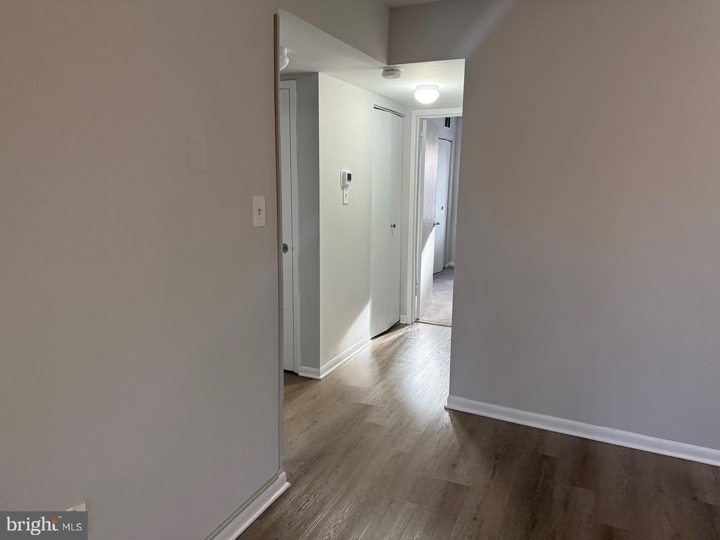 1400 Northgate Square, Unit 11A Reston, VA 20190 - Photo 17 of 23 a view of a hallway with wooden floor