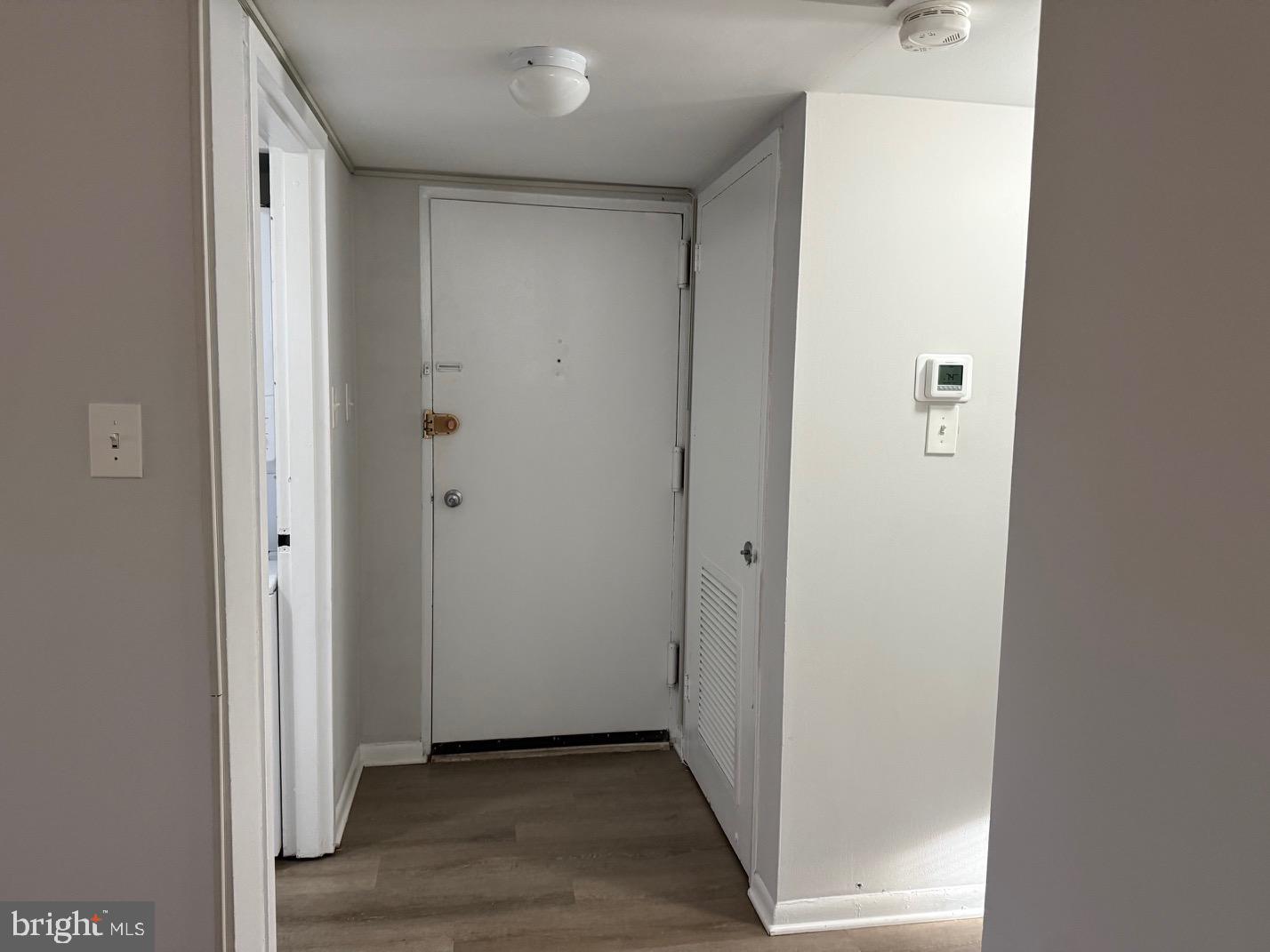 1400 Northgate Square, Unit 11A Reston, VA 20190 - Photo 21 of 21 a view of a hallway with wooden floor