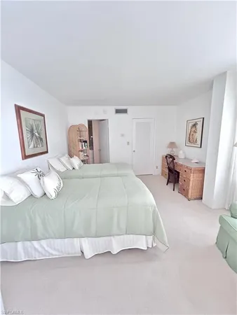 a bedroom with a bed and furniture