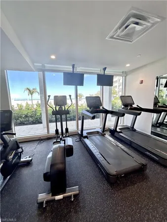 a room with gym equipment and a table