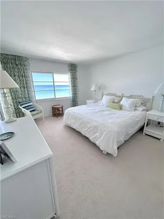 a bedroom with bed and window