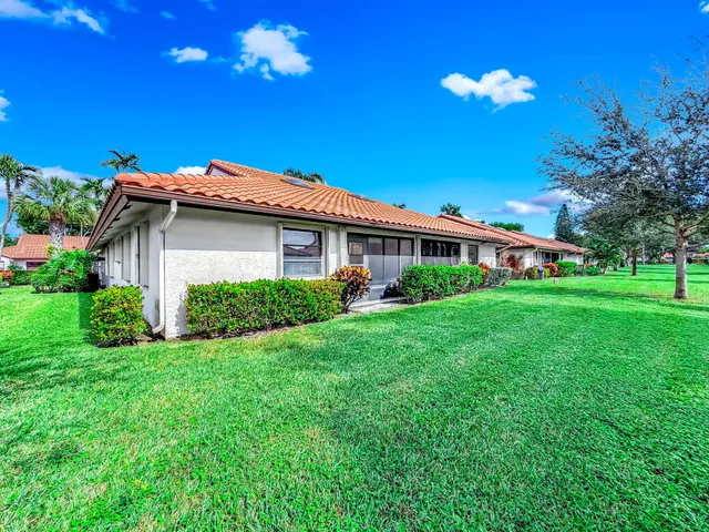 a view of a big yard of front a house