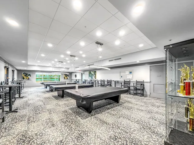 a living room with lots of furniture and a rug