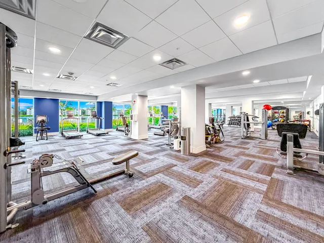 a large room with lots of counter space and wooden floor