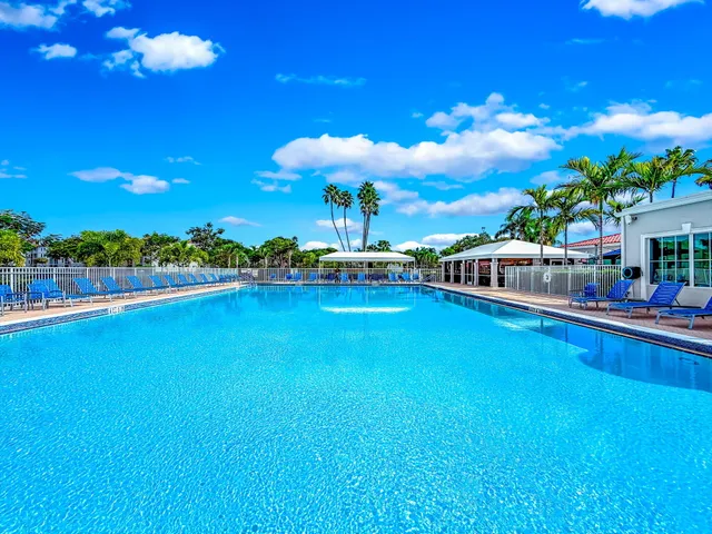 a view of outdoor space with a garden and trees