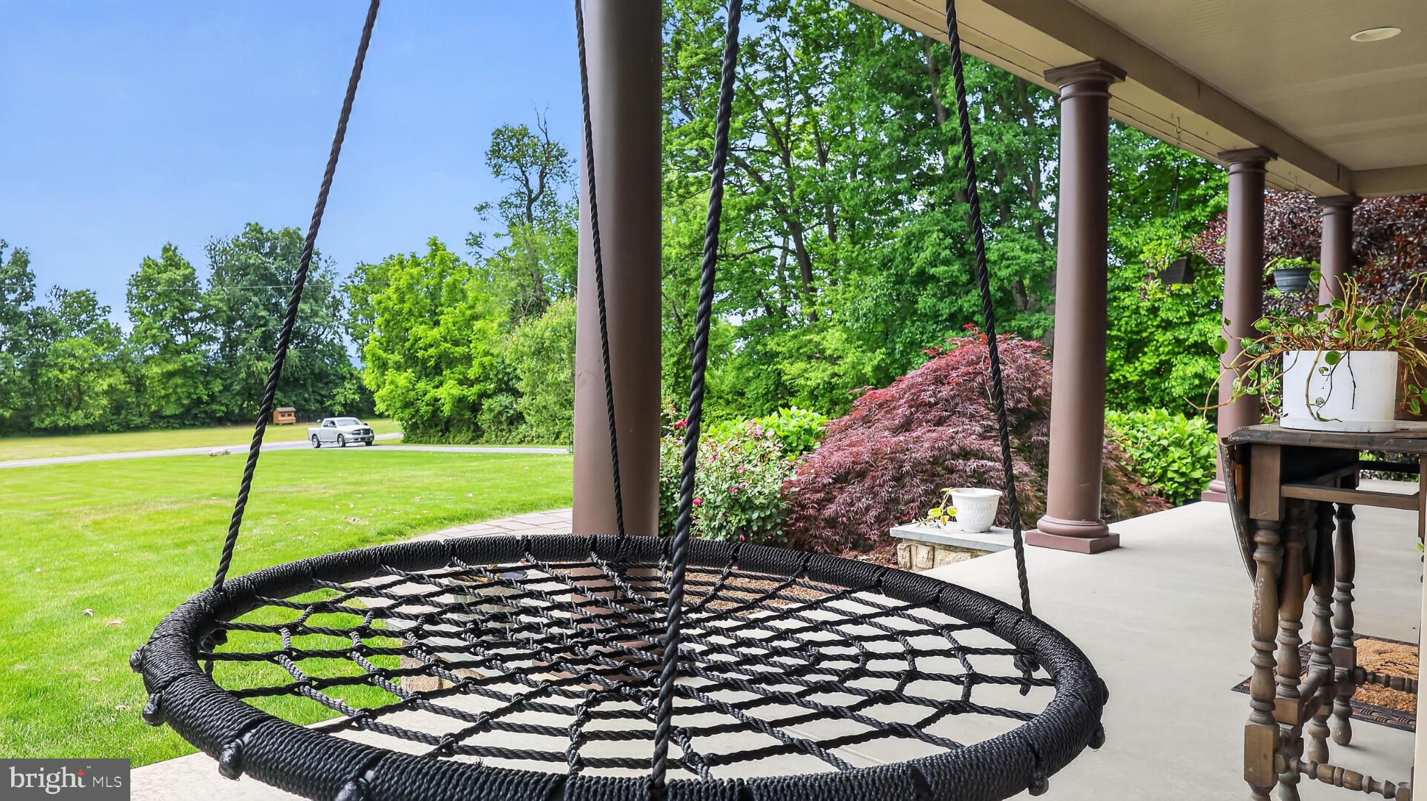 5325 Hammond Road New Holland, PA 17557 - Photo 50 of 73 Relaxing swing amidst lush greenery.