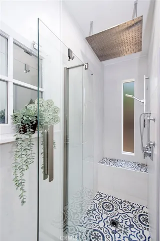 a bathroom with a shower and a sink