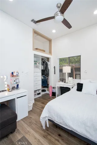 a large white bed in a white room