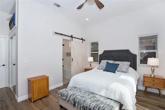 a bedroom with a bed and dresser