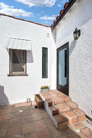 a bedroom with bed and window