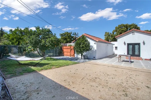 a view of a house with a yard and a garage